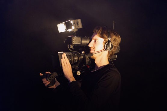 Man using camera - video editor online